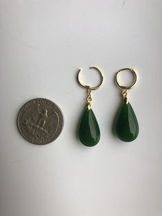 A pair of vintage dark green jade earrings. The teardrop-shaped earrings are made from quality natural green jade and 925 sterling silver hooks plated with 18K Gold. The delicate emerald-like green jade drops are natural, comes with modern gold hooks. It's truly a great combination of modern minimalistic design and ancient Chinese royalty taste. Some highlights of this elegant and charming dangle silver jade earrings are: *High-quality materials Made with high quality real green jade, 925 sterli Green Jade Earrings For Pierced Ears, Green Teardrop Nickel Free Hoop Earrings, Nickel-free Green Teardrop Hoop Earrings, Green Teardrop Nickel-free Hoop Earrings, Jade Hoop Earrings For Gift, Vintage Jade Round Earrings, Green Teardrop Hoop Earrings, Vintage Green Jade Earrings, Green Dangle Hoop Earrings