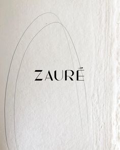 the word zaure is written in black on white paper