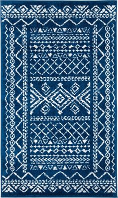 a blue rug with white designs on it