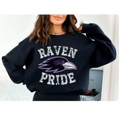 This distressed ravens sweatshirt perfect to show your school spirit or love of the game! Makes a great gift for the ravens mom! This distressed raven design is perfect on the popular Gildan brand sweatshirt. This vintage style sweatshirt will keep you warm throughout the season!  A pre-shrunk, classic fit sweater that's made with air-jet spun yarn for a soft feel and reduced pilling. ** P R O D U C T **  - 50% cotton, 50% polyester  - Pre-shrunk  - Classic fit  - Direct to Garment print (no ste School Spirit Sweatshirt With Screen Print Fan Merchandise, School Spirit Sweatshirt With Screen Print For Fans, School Spirit Sweatshirt With Screen Print, University Logo Fan Apparel Sweatshirt, Black School Spirit Sweatshirt For Sports Events, Team Logo Sweatshirt For School Spirit, Team-colored Sweatshirt For School Spirit, School Spirit Sweatshirt With Team Logo, School Spirit Sweatshirt For Fan Merchandise