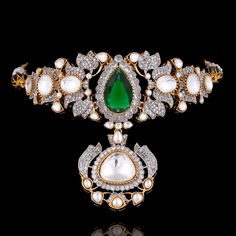 Let your style soar to new heights as you flaunt this handcrafted marvel, designed to capture attention! Introducing a beautiful set that promises to elevate your look with its unique blend of modernity and tradition. Crafted with CZ, kundan, and emerald stones, this beauty exudes a celestial charm that is simply unmatched. The set includes a necklace and a pair of stud earrings. Approximate earrings length is 0.5" Designed over high-quality brass as base metal with gold and silver plating.﻿ Mad Elegant Designer Wear Sets With Tilla Details, Luxury Stone Work Jewelry Sets For Festive Occasion, Festive Kundan Necklace With Hand Set Details, Festive Kundan Necklace Hand Set For Designer Wear, Elegant Sets With Stone Work For Designer Occasions, Bollywood Style Emerald Kundan Necklace For Wedding, Luxury Kundan Necklace With Stone Work For Festive Season, Luxury Kundan Necklace With Meenakari For Festive Occasions, Luxury Kundan Meenakari Necklace For Festive Occasions