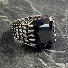 Silver Square Black Onyx Gemstone Ring , Men Natural Dark Black Stone Ring , Handmade Knit Patterned Ring , 925K Sterling Silver , Gift For Him , Same Day For Shipping ✧ Product Details * Handmade İtem * Gender : Male / Female * Material : 925K Sterling Silver * Ring Weight : 10.5 Grams * Gemstone Type : Black Onyx ✔ Usage Details * Silver jewelry is very sensitive to chemicals. It is recommended to keep away from chemical substances such as cream, bleach, deodorant, detergent. * Silver jewelry can also darken quickly in salt water, that is, in sea water. For this reason, it is best to remove them when swimming in the sea. ✔ Shipping * Your orders placed on weekdays are delivered to the cargo on the same day. Your orders placed on the weekend are delivered to the cargo on Monday. ✔ Other D Handmade Black Sterling Silver Signet Ring, Elegant Black Skull Ring In Sterling Silver, Elegant Black Sterling Silver Skull Ring, Handmade Black Skull Ring As Gift, Handmade Black Skull Ring For Gift, Luxury Handmade Black Rings, Luxury Black Signet Ring Stamped 925, Chemical Substances, Black Stone Ring