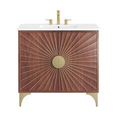 an art deco bathroom vanity with gold accents and a white sink on the top, against a white background