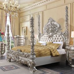 a fancy bedroom with gold and silver furniture in it's centerpieces, including a bed