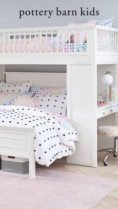 a white bunk bed sitting next to a pink rug