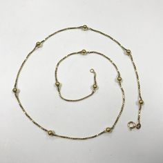 "PLEASE READ ENTIRE DESCRIPTION BEFORE PURCHASING For Sale: (1) Stunning 18k Yellow Gold Box Chain Necklace with Gold Beads Please see pictures for more details! Features: Beautiful 18k yellow gold necklace with gold beads. The clasp is stamped 750. The rest of the gold has been tested to 18k gold. This is a stunning piece!! In great condition. May be small surface scratches from normal wear. (AS SEEN IN PICTURES) Specifics: Necklace approx. 22\" long Total weight 9.6 grams --------------------- Gold Box Chain Necklace With Round Beads, Gold Necklace With Box Chain And Round Beads, Yellow Gold Beaded Chain Necklace, Formal Jewelry With Round Beads Chain, Formal Necklaces With Chain And Round Beads, Yellow Gold Beaded Necklaces For Formal Occasions, Formal Yellow Gold Beaded Necklaces, Yellow Gold Necklace With Box Chain And Round Beads, Yellow Gold Box Chain Necklace With Beads