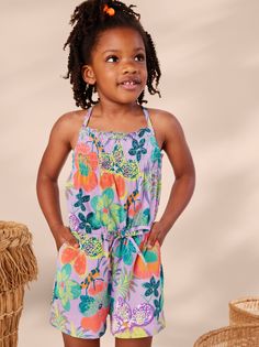 Our in-house artists designed this exclusive print inspired by their recent trip to Kenya. Looks like such a cute dress, but look again! This Tea favorite is a summer-ready romper that allows your kiddo such freedom to play. A smocked bodice adds even more style and comfort. Crafted from 100% soft cotton jersey that keeps its color. Decorative waist tie on the elastic waist. Slash pockets. Thigh length. Casual Bubble Romper For Spring Vacation, Spring Vacation Bubble Romper For Summer, Spring Summer Style Bubble Romper For Vacation, Casual Bubble Romper With Floral Print For Spring, Casual Floral Print Bubble Romper For Spring, Casual Sleeveless Floral Print Bubble Romper, Playful Floral Print Bubble Romper For Playwear, Playful Floral Bubble Romper For Playwear, Summer Bubble Romper With Floral Print