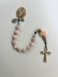 "Welcome to my Shop \"CREATING STILL MOMENTS.\"   To see all my listings and offerings, please visit my shop at  https://www.etsy.com/shop/CreatingStillMoments?ref=sh-carousel-1  Handmade Rosary Handmade Rosary | Pocket Rosary | Cameo rosary| Pink Rose Quartz beads Pink rose, Catholic mom, catholic gift, Confirmation, Catholic gift Catholic mom, catholic gift, RCIA gift Light Pink Madonna of the Streets Pocket Rosary, Light Pink RosenQuartz beads, Pink rose, Confirmation gift RCIA gift St Benedi Mother's Day Spiritual Rosary, Adjustable Rosary With Miraculous Medal Gift, Pink Rosary With Miraculous Medal As A Gift, Beautiful Rosaries, Pink Rosary, Catholic Confirmation Gifts, Catholic Confirmation, Pocket Rosary, Handmade Rosary