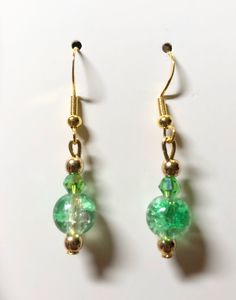 Gold plated findings. green beads. hypoallergenic materials. Lightweight. Green Beaded Teardrop Jewelry, Green Round Earrings For May Birthstone, Green Earrings For May Birthstone, Green Beaded Dangle Teardrop Earrings, Green Teardrop Beaded Earrings For Party, Nickel-free Green Earrings For Party, Green Nickel-free Party Earrings, Nickel-free Green Beaded Earrings For Parties, Green Beaded Crystal Earrings