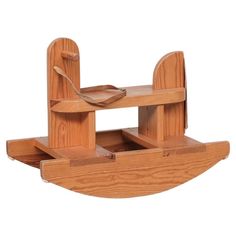 a wooden toy boat with two seats on it