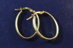 -Vintage 14k Gold Italy Oval Shape Hoop Earring -Inside diameter: 0.75 in x 0.55 in -Earring thickness: 3 mm x 1.8 mm -Total weight: 1.2 g -Marked 14k, Italy Oval Yellow Gold Hoop Earrings Stamped 14k, Oval 14k Stamped Yellow Gold Hoop Earrings, Formal 14k Gold Oval Hoop Earrings, Classic Oval Hoop Earrings As Gift, Gift 14k Stamped Oval Hoop Earrings, Classic Oval Link Earrings For Formal Occasions, Oval 14k Gold Hoop Earrings For Anniversary, Persian Turquoise, Perfect Stocking Stuffers