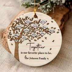 a wooden ornament with the words together on it and a tree in the middle