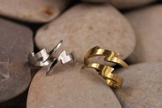 "These lightning bolt rings perfect gift for those that love jewelry, streetwear, or minimalism. The thunderbolt flash bands are made of hypoallergenic stainless steel and are 100% nickel/lead free! We would never sell something that would turn your skin green. We have the choices between two colors they're available in gold and silver plating. 𝐅𝐈𝐍𝐃 𝐘𝐎𝐔𝐑 𝐏𝐄𝐑𝐅𝐄𝐂𝐓 𝐒𝐈𝐙𝐄 You can use the following methods along with the size guide below to get the perfect fit on your ring! 𝐒𝐢𝐳𝐞 Bolt Ring, Lighting Bolt Earrings, Lightning Bolt Ring, Lightning Bolt Jewelry, Ring Chart, Lightning Bolt Pendant, Lightning Bolt, Gold And Silver, Stackable Rings