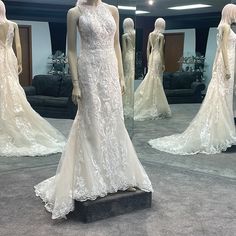 mannequins dressed in wedding gowns on display