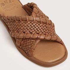 The hottest trend this season is woven sandals. DNA Footwear has you covered with the Woodruff sandal. Handwoven leather styled as a simple slide gives you the look of the season. Pair them with a floral print dress for a truly tropical outfit. You are going to LOVE these. Genuine leather uppers Woven leather straps Padded footbed for comfort Soft rubber outsoles STYLENAME: WOODRUFF-COG Summer Open Toe Mules With Intrecciato Weave, Casual Woven Leather Mules With Flat Heel, Summer Woven Leather Synthetic Mules, Chic Brown Woven Sandals, Summer Mules With Woven Leather In Synthetic, Spring Woven Leather Slip-on Slides, Flat Woven Leather Slides For Spring, Woven Leather Slides For Spring, Summer Mules With Woven Leather