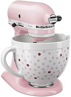 a pink kitchen aid mixer with polka dot design on the bowl and handle is shown