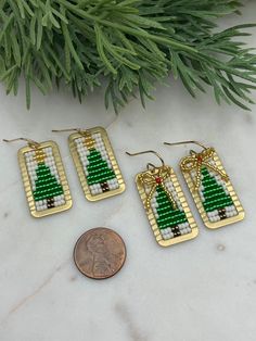 Introducing our fabulous and festive Christmas Tree Earrings. Hand beaded using premium seed beads and golden brass accents, these playful and gorgeous earrings add an extra touch of charm to your holiday ensemble. The perfect gift option, these eye-catching earrings make for an ideal stocking stuffer or a thoughtful present for a loved one. With these festive holiday earrings, you're sure to make a statement and spread joy wherever you go! Choice of with bow or without ✔️1 5/8 inches long & 5/8 Jewelry Holiday, Beaded Jewlery, Tree Earrings, Holiday Earrings, Christmas Tree Earrings, Bead Ideas, Beaded Earrings Patterns, Craft Show Ideas, Holiday Earring