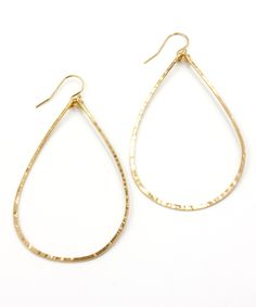 "Hammered and formed by hand, our Olivia Teardrop Earrings come with extra shimmer and in a size for everyone. This large 2.5\" size is one of Heather's Top Picks that everyone should own - they are lightweight, sturdy for travel, and a modern update to the basic hoop. To ensure the longevity of this design, all elements are made from high quality 14k Gold Filled or Sterling Silver wire that is hypoallergenic and will not flake, discolor or wear off over time. Looking for a different size? The O Tarnish Resistant Teardrop Hoop Earrings, Gold Hoop Teardrop Earrings, Tarnish Resistant, Handmade Teardrop Yellow Gold Hoop Earrings, Yellow Gold Teardrop Hoop Earrings With Ear Wire, Hand-forged Teardrop Hoop Earrings, Metal Drop Hoop Earrings With Ear Wire, Everyday Hand Forged Teardrop Hoop Earrings, Everyday Hand Forged Teardrop Earrings, Hammered Yellow Gold Dangle Hoop Earrings