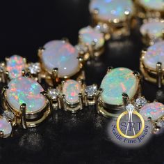 "Opal and Diamond Necklace 17\" Solid 14K Yellow Gold Australian Opals. Brand New BRAND NEW METAL: Solid 14K Yellow Gold MAIN STONE: 49 Natural Australian Opals 13.9ctw  OTHER STONE(S): 50 Diamonds 2.05ctw LENGTH: 17\" APPRAISED VALUE: $33,110 This necklace features 49 gorgeous Australian opals from the famous Coober Pedy mine we have set into this solid 14K gold choker setting. The oval shaped opals have outstanding color with flashes of reds, greens, blues, and yellows, and total nearly 14 tot Vintage Jewellery Rings, Coober Pedy, Black Hills Gold, All Gems, New Metal, Be Natural, Gold Choker, Yellow Gold Pendants, Choker Necklaces