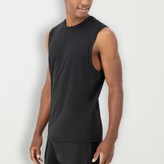 Engineered with peached interlock fabric, this men's performance tank boasts an incredibly soft feel. 4-way stretch means you're getting a fit that moves as freely as you do, while moisture-wicking technology keeps you cool and comfortable. The design game is strong here, with wide self-fabric details at the neck and armholes, all neatly tied together with flatlock stitching. And guess what roomy armholes give you space to maneuver without any hassle.Features: Moisture WickingClosure Type: Pull… Black 4-way Stretch Sleeveless Top, Black Sleeveless Tops With 4-way Stretch, Black Sleeveless 4-way Stretch Top, Black 4-way Stretch Sleeveless Tank Top, Black Sleeveless Tank Top With 4-way Stretch, Technical Sleeveless Top With 4-way Stretch, Breathable Sleeveless Muscle Tee In Athletic Fit, Functional Sleeveless Muscle Tee For Light Sports, Functional Black Tank Top For Light Sports