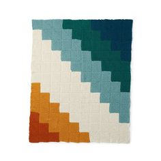 a quilt made with different colors and shapes on a white background in the shape of squares