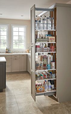 an organized pantry in the middle of a kitchen