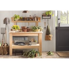 a kitchen area with pots, pans and utensils