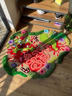 the rug is made to look like it has been decorated with flowers and plants on it