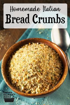 homemade italian bread crumbs in a bowl on a blue napkin with a spoon