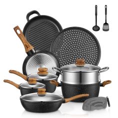 an assortment of pots and pans with wooden spoons next to them on a white background