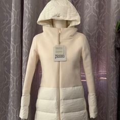 Nwt Herno White Wool Puffer Down Coat With Removal Hood In Size 38. Condition: New With Tags. Made In Italy. Beautiful And Stylish A-Shape Coat With Mixed Materials Of Wool And Down. Features Front Zippered Lined Hand Pockets. Removable Hood. Down Insulation: 90/10 Goose Down/Goose Feather. Retails For $1195. 100% Authentic. Please Let Me Know If You Have Any Questions. Thank You. Designer Cream Outerwear For Winter, Elegant Fitted Outerwear With Detachable Hood, Luxury Fitted Cream Outerwear, Designer White Winter Outerwear, Fitted Winter White Outerwear With Detachable Hood, Designer Fitted White Outerwear, White Fitted Luxury Outerwear, Designer White Fitted Outerwear, Herno Woman