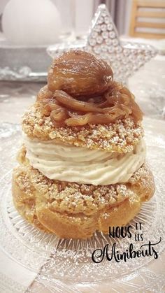 a stack of three desserts sitting on top of a glass plate