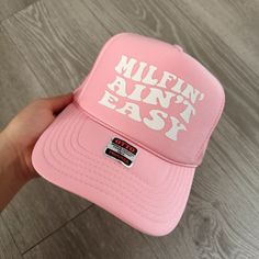 Milfin Ain’t Easy Trucker Hat Graphic Trucker Hat, Spring Snapback Hat With Letter Print, Casual Trucker Hat With Wide Brim For Spring, Casual Wide Brim Trucker Hat For Spring, Trucker Hats Bachelorette, Everyday Summer Trucker Hat, Snapback Hat With Short Brim For Spring, Spring Everyday Trucker Hat With Curved Brim, Everyday Spring Flat Brim Trucker Hat