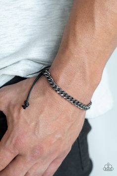 Shiny black cording knots around the ends of a gunmetal beveled curb chain that is wrapped across the top of the wrist for a versatile look. Features an adjustable sliding knot closure. Sold as one individual bracelet. Adjustable Sliding Knot, Mens Bracelet Black, Sliding Knot Closure, Turquoise Bead Bracelet, Black Bracelet, Purple Pearl, Purple Rhinestone, Sliding Knot, Black Bracelets