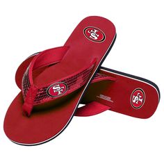 a pair of red slippers with san francisco logo