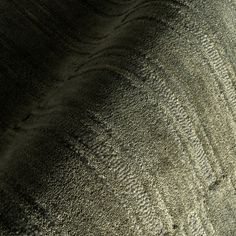 an aerial view of the sand and water