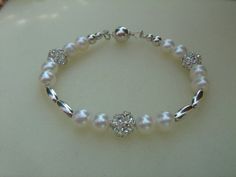 Hey, I found this really awesome Etsy listing at https://www.etsy.com/listing/269128827/strap-me-pearl-and-silver-summery Silver Pearl Bracelet For Party, Elegant Pearl Bracelet With Silver Beads For Wedding, Silver Bracelets With Pearl Charm For Party, Silver Bracelet With Pearl Charm For Party, Silver Beaded Pearl Bracelet, Silver Pearl Beaded Bracelets, Elegant Silver Crystal Bracelet With Pearl Charm, Silver Pearl Chain Bracelet For Parties, Silver Pearl Bracelet With Pearl Charm For Party