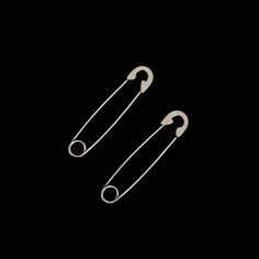 Sold as a pair, these safety pin shaped earrings are unique and edgy pair of earrings that can be worn multiple ways, through one piercing or through multiple piercings. These earrings are specifically made to be earrings and so the pin of these earrings are blunter and not as sharp as real safety pins.  The earrings are approximately 3.85cm long and 0.8cm wide.  These earrings are available in a spiked version: Vicious Spiked Safety Pin Earrings All our jewellery is made from stainless steel so they are 100% waterproof, tarnish-free and hypoallergenic. Safety Pin Tattoo, Pin Tattoo, Gothic Jewellery, Multiple Piercings, Safety Pin Earrings, Pin Earrings, Punk Grunge, Safety Pins, Jewelry Birthday