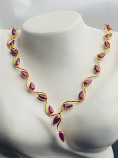 This necklace  will elevate your whole outfit for any special occasions.  Natural Burmese Ruby Necklace in 18K  Yellow  Gold.  Weight of Ruby  18 pcs  7.5 ct Total weight of necklace  9.61 gm Gold net weight 8.11 gm Length and Width of each Stone  7.56 X 3.88 mm. 7.75 x 3.58 mm. 6.45 x 3.39 mm 6.44 x 3.82 mm (average) Length of necklace - 53.5 cm Length and width of Ruby   175.5 x 21.22 mm Gemstone  -   Natural Burmese Ruby Treatments -  Natural Heated.  { No Treated /No Colour Dye } Colour  - Formal Bridal Necklace In Yellow Gold With Gemstone, Formal Yellow Gold Bridal Necklace With Gemstone, Formal Ruby Necklace With Hallmark, Formal Ruby Gemstone Necklaces, Formal Ruby Gemstone Necklace, Gemstone Bridal Necklace For Formal Occasions, Elegant Ruby Necklace For Formal Occasions, Formal Bridal Gemstone Necklace, Ruby Gemstone Bridal Necklace For Anniversary