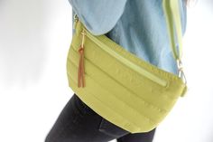 This bag is a trendy take on the updated fanny pack that can be worn in multiple ways. Wear it as a crossbody, bum bag, belt bag, fanny pack, or shoulder bag. Available in 4 colors and features a fun half moon shape with a coordinating canvas strap and gold hardware. Inside is a zippered pocket to keep all of your essentials safely organized.Adjustable waist / shoulder strap from 29 inches up to 48 inchesInterior zipper pocket for easy access to your credit cards and ID Bag measures 11" x 7" at Trendy Nylon Shoulder Bag With Cell Phone Pocket, Casual Satchel Belt Bag For On-the-go, Trendy Green Belt Bag For Everyday, Versatile Green Belt Bag With Adjustable Strap, Trendy Nylon Belt Bag For On-the-go, Green Belt Bag With Zipper Closure, Trendy Green Belt Bag With Zipper Closure, Green Shoulder Belt Bag With Zipper Closure, Green Commuting Bag With Adjustable Strap