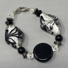 a black and white bracelet with glass beads