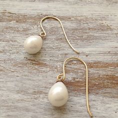 Such a beautiful pearl earrings.This earrings are perfect for the bride or bridesmaid. This earrings will look great on you! Dainty and delicate earrings.Perfect for your wedding! All my jewelry are packed in an elegant gift box.If you want to give it as a gift you can specify the address and I'll be happy to send it on your behalf. Classic Pearl Teardrop Earrings For Wedding, Delicate Teardrop Pearl Earrings For Pierced Ears, Classic Teardrop Pearl Earrings For Wedding, Graceful Teardrop Pearl Earrings For Weddings, Elegant White Teardrop Earrings For Gift, Classic Wedding Teardrop Pearl Drop Earrings, Elegant Drop Bridal Earrings For Wedding Gift, Delicate Pear-shaped Pearl Earrings, Hypoallergenic Pear-shaped Teardrop Earrings For Wedding