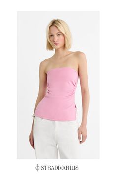 Fitted top with a straight neckline and exposed shoulders. Gathered fabric detail on the sides. Side vents at the hem. Available in several colours. Chic Bandeau Top With Built-in Bra, Stretch One-shoulder Top With Built-in Bra, Fitted Bandeau One Shoulder Top For Summer, Pink Stretch One-shoulder Top, Spring Off-shoulder Tube Top With Built-in Bra, Chic One-shoulder Knit Top, Summer Tops With Straight Neckline For Night Out, Fitted Off-shoulder Tank Top For Spring, Chic One-shoulder Knit Top For Spring