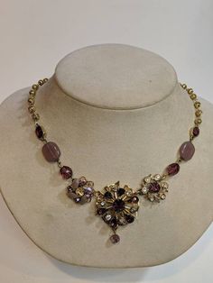 A Lovely purple and lavender Rhinestone flower Pendant Necklace. An unique one of a kind statement Assemblage.   Comprised with vintage jewelry parts and pieces.  Necklace length is adjustable from 18 to 21 inches. I am always happy to customize lengths upon request free of charge. Centerpiece measures 1 1/4 by 1 1/4 inch.  Please feel free to ask any questions you may have regarding this Feminine accent piece.  Click here to see our other Vintage Assemblages www.etsy.com/shop/ravished?section_i Bohemian Jeweled Purple Jewelry, Vintage Adjustable Purple Jewelry, Adjustable Vintage Purple Jewelry, Purple Jeweled Necklaces For Party, Purple Jeweled Party Necklace, Vintage Lavender Amethyst Jewelry, Purple Vintage Jewelry For Party, Vintage Lavender Jewelry, Purple Jeweled Necklace For Formal Occasions