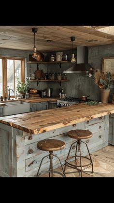 a kitchen with two stools in front of an island and counter top made out of wood