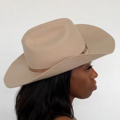 The Upland Western Cowboy Hat seamlessly blends the rustic charm of the Wild West with a dash of futuristic boho flair. With its distinctive cowboy silhouette, complete with a cattleman creased crown and a stylish upturned brim, this hat exudes classic Texan allure. The leather band is adorned with gleaming silver jewe Cowboy Silhouette, Western Cowboy Hats, The Wild West, Silver Jewels, Cowboy Hat, Western Cowboy, Wild West, Leather Band, Rustic Charm