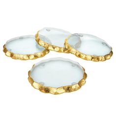 three white and gold plates on a white background