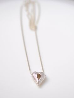 "This whimsical silver heart charm holds a special meaning that resonates with mothers and daughters alike. The delicate heart shape symbolizes the deep bond between a mother and child, making it an ideal gift for moms.   The charm features a unique design inspired by a bird's nest, symbolizing the warmth and protection of a mother's love. Made of high-quality silver, the puffy heart pendant is not only a beautiful piece of jewelry but also a heartfelt expression of motherhood and maternity. Whe Delicate Heart Charm Jewelry For Wedding, Unique Heart Pendant Jewelry For Wedding, Unique Heart Pendant Wedding Jewelry, Elegant Handmade Heart Pendant Jewelry, Delicate Heart-shaped Jewelry For Wedding, Unique Wedding Jewelry With Heart Pendant, Delicate Double Heart Jewelry As Gift, Handmade Heart Pendant Jewelry For Wedding, Delicate Open Heart Silver Jewelry