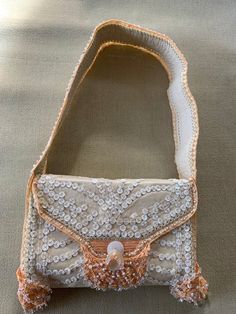 "Buba, beaded leather shoulder bag, in beautiful as close to new as you can get, peach, beige, mother of pearl shaded beads, is a stunning statement of bold \"Pretty Woman\" style." Beige Embellished Rectangular Shoulder Bag, Summer Beige Embellished Shoulder Bag, Beige Beaded Festival Bags, Embellished Beige Clutch Shoulder Bag, Beige Embellished Clutch Shoulder Bag, Bohemian Cream Beaded Bag, Evening Cream Embroidered Shoulder Bag, Cream Embroidered Shoulder Bag For Evening, Elegant Rectangular Shoulder Bag For Festivals