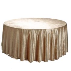 a round table with a gold cloth on it